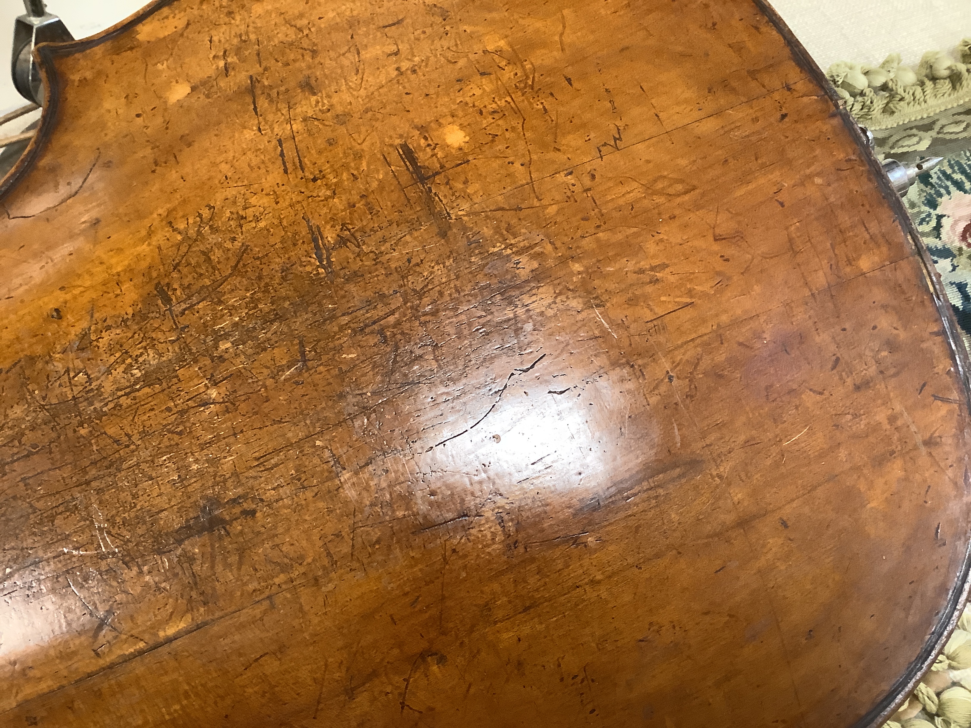 An early 20th century cello for restoration, indistinct internal label; ‘Restored by William J. Acton, Green Street, Forest Gate, London 1910’ length of body 72cm.